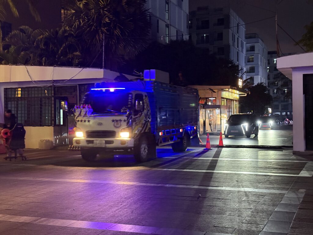 A truck filled with furniture exits the gates of the Kaibo or KB Casino compound in Cambodia's Sihanoukville city around 10 p.m. on January 14, 2026. (Mech Dara/Mekong Independent)