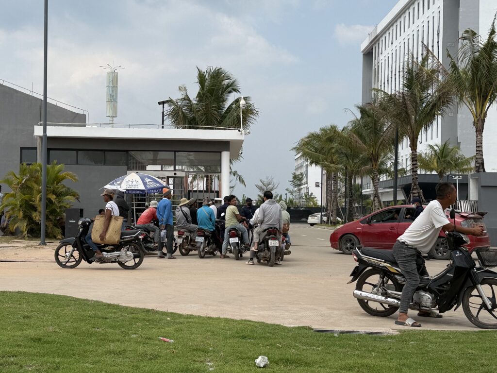Motorbikes wait at a security checkpoint within the Dara Sakor Resort in Cambodia's Koh Kong province on January 26, 2026. (Mech Dara/Mekong Independent)
