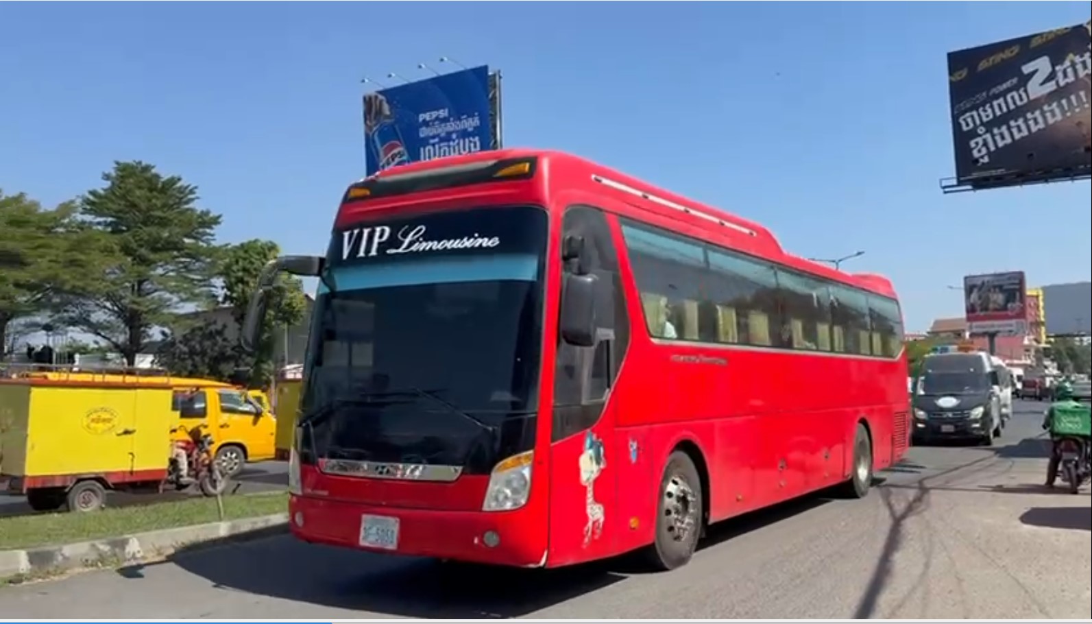 A bus carrying foreigners who say they are stuck in Cambodia after the opening of scam businesses. (Mech Dara/Mekong Independent/Creative Commons)