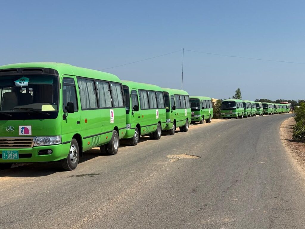 Twelve buses park along the side of the road near the A7 Park in Cambodia's Bavet city on February 1, 2026. (Mech Dara/Mekong Independent)